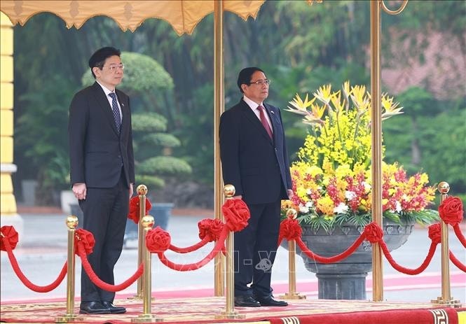 Thủ tướng Phạm Minh Chính chủ trì Lễ đón Thủ tướng Singapore và Phu nhân - ảnh 2