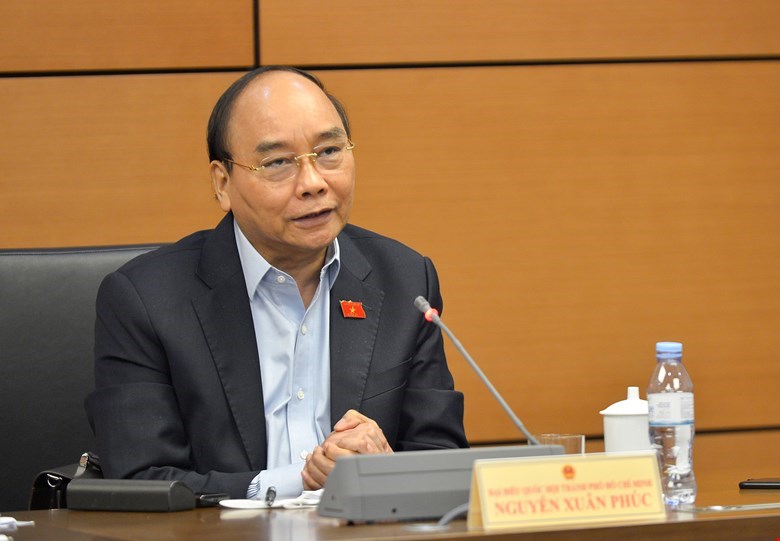 Chủ tịch nước Nguyễn Xuân Phúc - Đại biểu Quốc hội thành phố Hồ Chí Minh, phát biểu tại phiên họp.